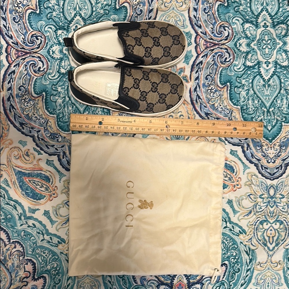 Authentic Gucci Kids slip on GG print navy blue size 26 comes with its dust bag.